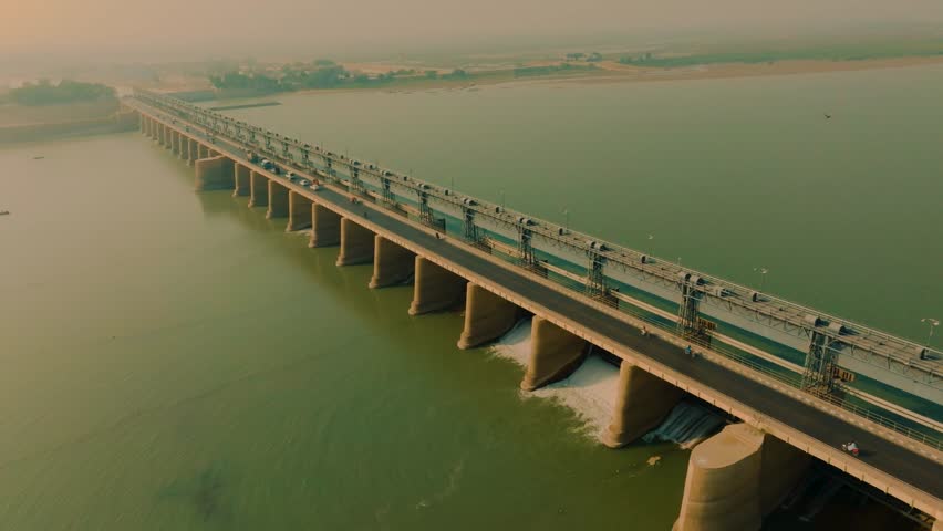 Aerial view of Kotri Barrage spanning the Indus River near Hyderabad Sindh Pakistan with concrete piers roadway deck and flowing water