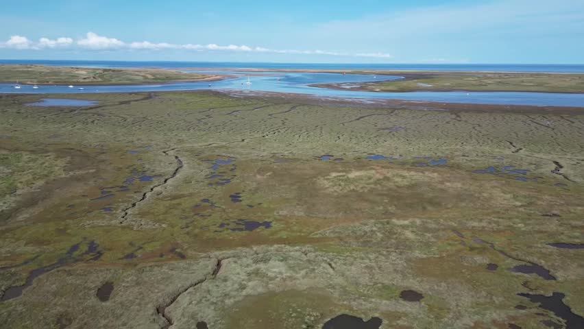 aerial View of Blue Tidal Channels Winding Through Salt Marshes at Burnham Deepdale Norfolk England
