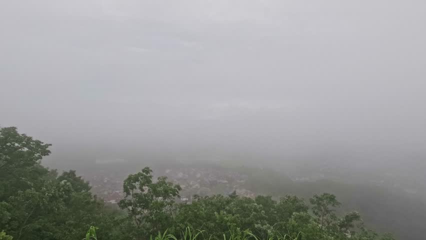 A time lapse on a rainy morning, when the fog clears like a vacuum cleaner 