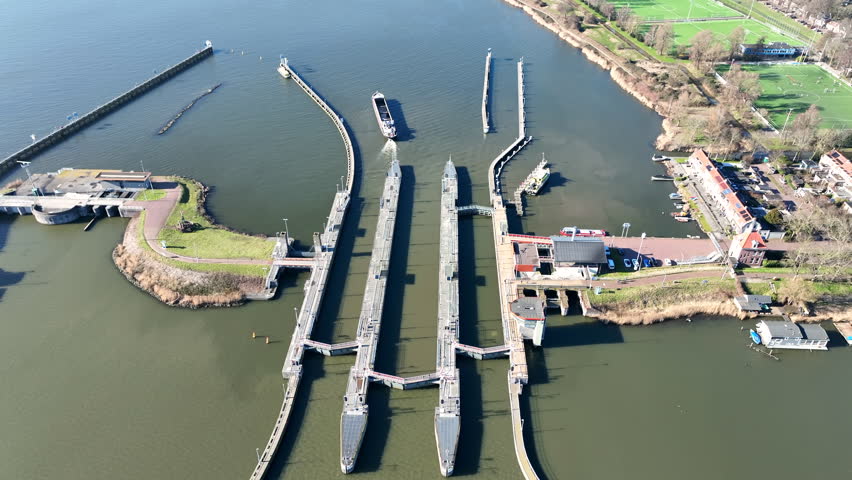 Industrial harbor sluices and water control infrastructure in Amsterdam, Europe.
