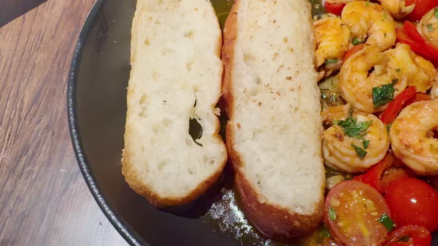 Fresh fried shrimp with crispy toast and tomatoes served on a plate