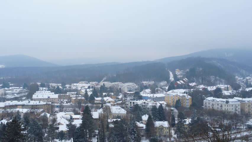 Residential district of Vienna in winter with railway and road