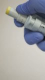 Vertical video close up of scientist adjusting micropipette volume scale in laboratory - Powered by Shutterstock - Get 15% off with code: PIKWIZARD15