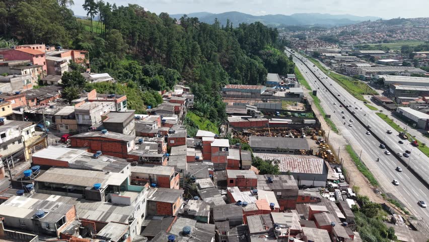 Aerial view of slum in Vila Galvão neighborhood and Fernão Dias Highway (BR-381) - Guarulhos, São Paulo, Brazil