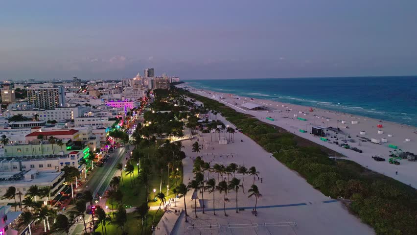 Miami beach city night panorama. Miami aerial downtown skyscrapers dusk. Miami waterfront bay evening. Miami Ocean drive iconic skyline.