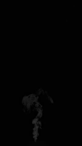 Slow Motion Shot of Slowly Rising Steam, Isolated on Black Background.