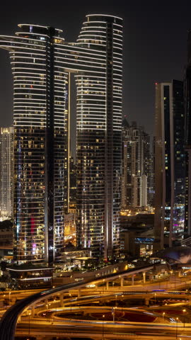 Timelapse of the incredible dubai skyline from a unique high vantage point at night in vertical