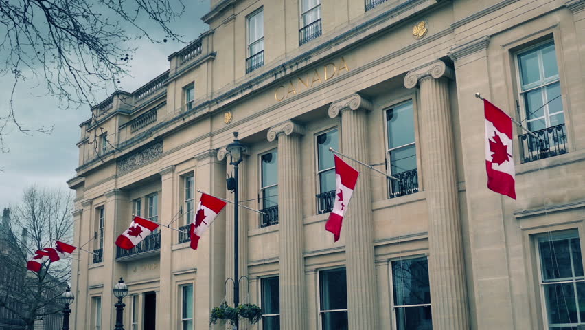 Building With Canadian Flags In The Daytime