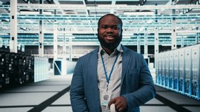 Portrait of smiling man in data center putting VR headset on to optimize electronics. Cheerful server hub system administrator using virtual reality simulation to monitor system performance, camera A - Powered by Shutterstock - Get 15% off with code: PIKWIZARD15