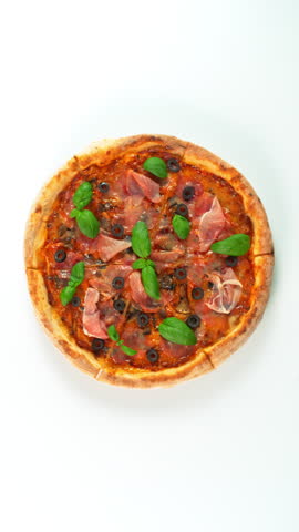 Rotating Fresh Pizza Capricciosa Endless Loopable Slow Motion Shot.