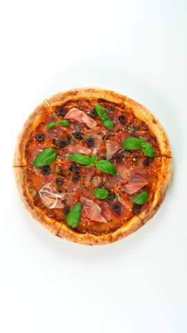 Rotating Fresh Pizza Capricciosa Endless Loopable Slow Motion Shot.