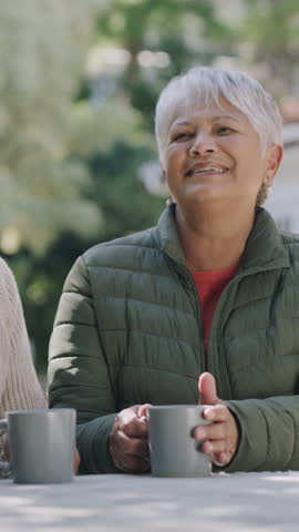 Morning, garden and senior couple with coffee and kiss for fresh air, bonding and connection. Retirement, marriage and elderly man with woman hug for conversation, love and affection with drinks
