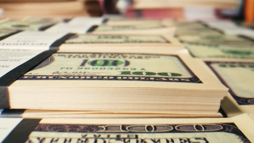 Banknotes and bag counter, Specialised police officer Counting dollar euro banknotes in crime lab with machine, cashed out criminal money, bitcoin changing, buying home flat in bank. 