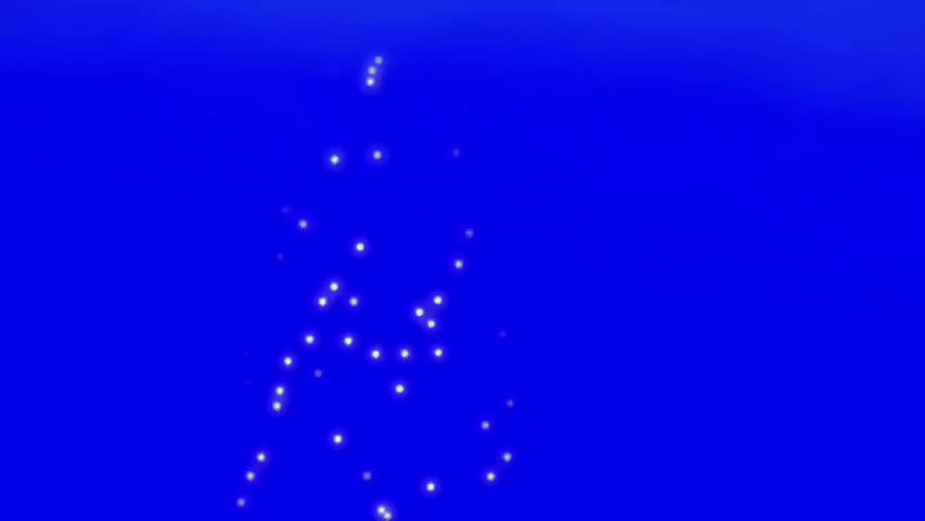 Glowing Sparkling  Tree Lights Forming Festive Holiday Shape on Blue Background 