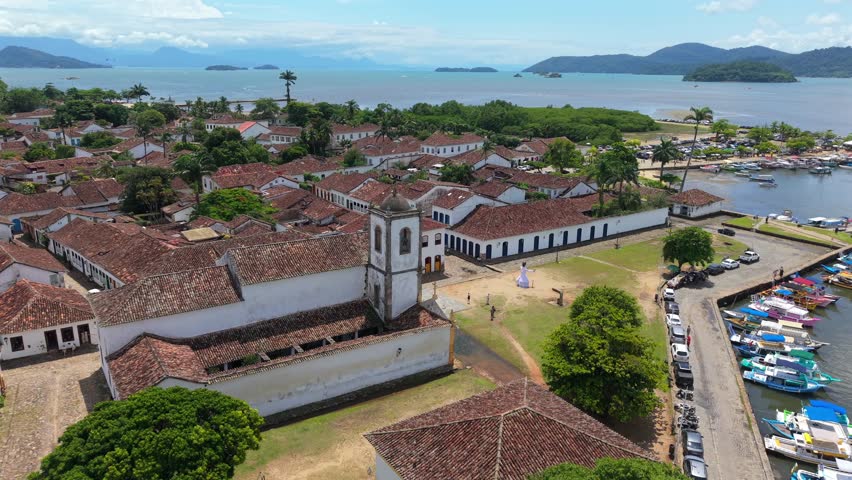 Paraty Historic Center colonial buildings and Igreja Matriz de Nossa Senhora dos Remédios facing Baía de Paraty marina and Atlantic coastline within Costa Verde region Rio de Janeiro Brazil, aerial