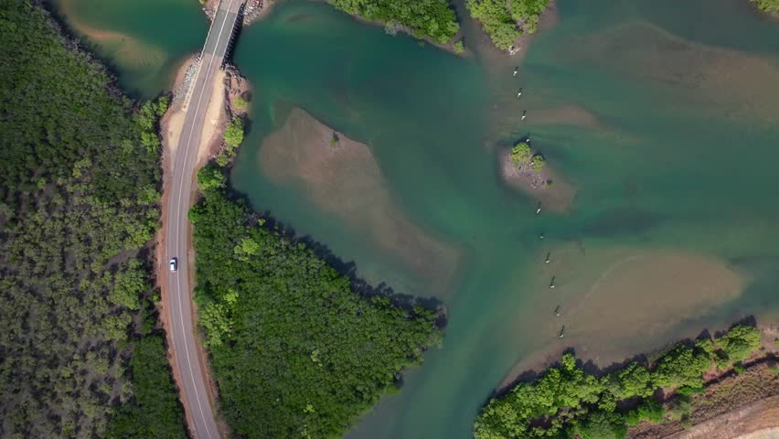 McCanes Bay Proserpine Bowen Jetty Coastal town Australia aerial drone Birdseye landscape Horseshoe Bay Airlie Beach sunny marina bridge car harbor view Great Barrier Reef Whitsunday Region upwards