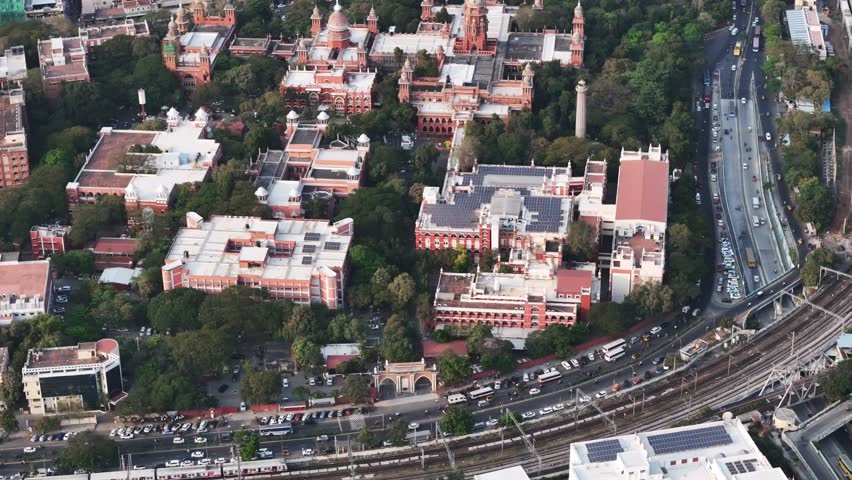 Long-distance aerial view of High Court of Judicature at madras background tamil nadu secretariat with port area and heavy traffic with crowded residentials buildings in chennai, tamil nadu