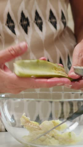 A woman prepares typical Sicilian food with homemade stuffed courgettes