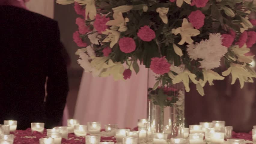 candles and flowers decorated on table for function celebration.