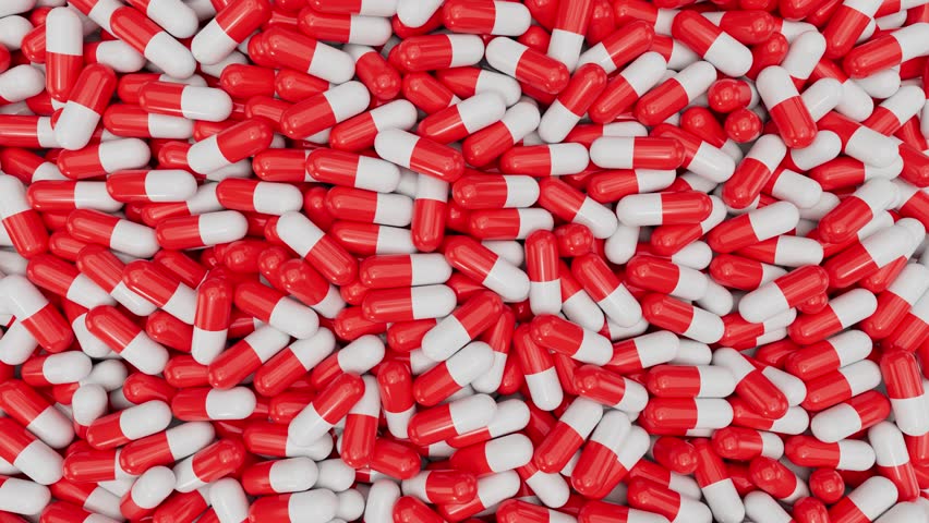 top view of red and white pill capsules background
