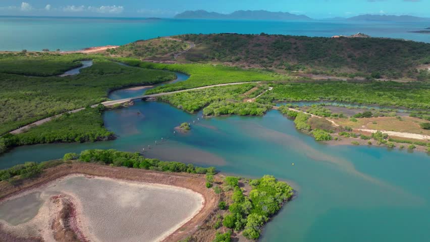 McCanes Bay Proserpine Bowen Jetty Coastal town Australia aerial drone landscape Horseshoe Bay Airlie Beach sunny marina bridge car harbor view Great Barrier Reef Whitsunday Region forward pan up