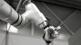 Industrial robotic arm with mechanical gripper operating in automated manufacturing factory. Robotics technology used for smart factory automation and modern industrial production. - Powered by Shutterstock - Get 15% off with code: PIKWIZARD15