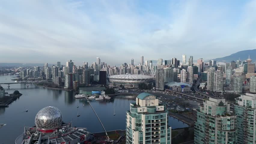 Science World Museum, BC Place Stadium, And Downtown Vancouver Skyline By False Creek In Canada. - aerial shot