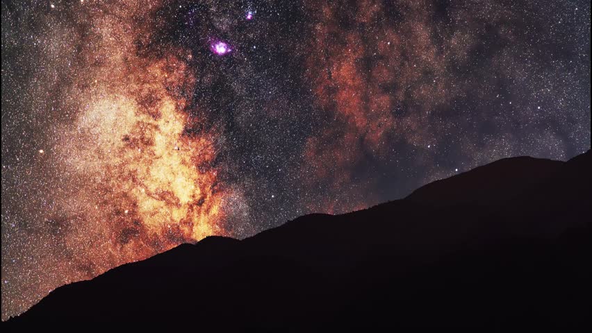 Night landscape, mountains under bright colorful milky way galaxy. Space, night scene time lapse.