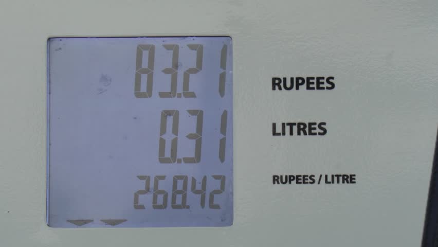 Digital display on a fuel pump showing price in Rupees and amount in Litres
