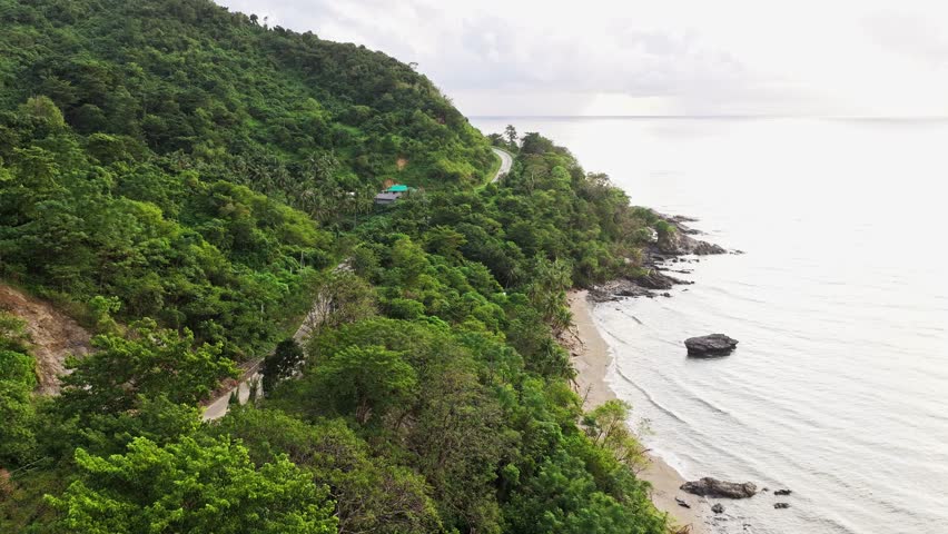 Forward drone flight, Puerto Princesa North Road in Palawan, during light rain