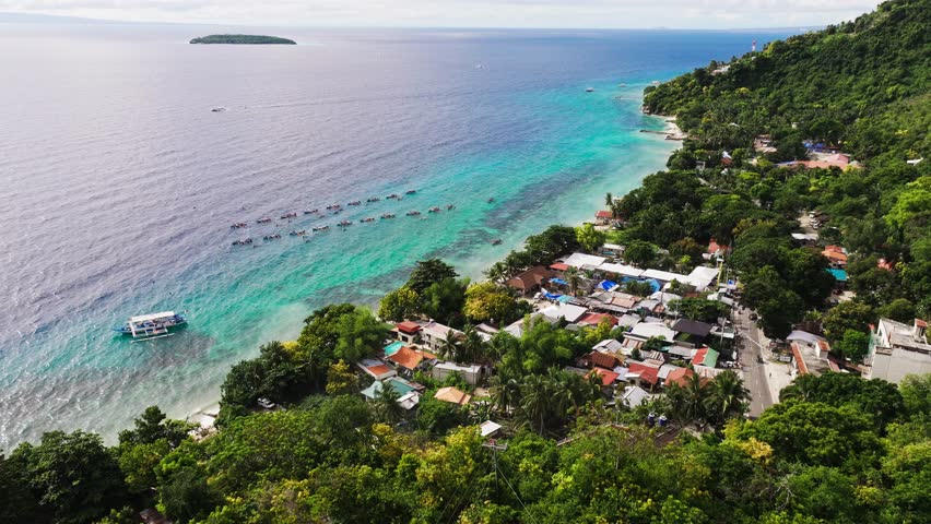 Oslob, Philippines, whale shark watching boats, vibrant green hillside village