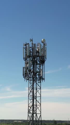 Cellular GSM tower with 3g, 4g, 5g transmitter. Communication antenna. Future technology. Vertical footage