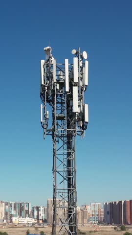 Cellular GSM tower with 3g, 4g, 5g transmitter. Communication antenna. Future technology. Vertical footage