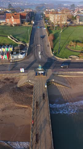 Aerial Drone Flyover of Swanage Bay and Jurassic Coastline in Dorset, UK, a dynamic aerial video of Swanage, a picturesque seaside town on the Jurassic Coast in Dorset, England.