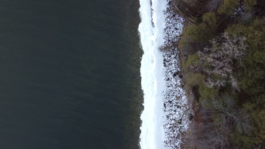 Aerial of Bay Shore Park off of Lake Michigan.  Door County Wisconsin.  Drone shot over Icy Shore Line.