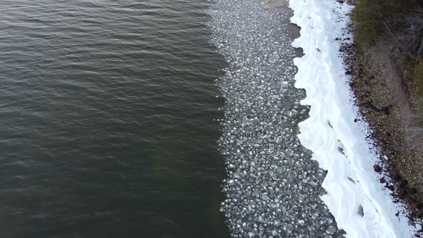 Aerial of Bay Shore Park off of Lake Michigan.  Door County Wisconsin.  Drone shot over Icy Shore Line.