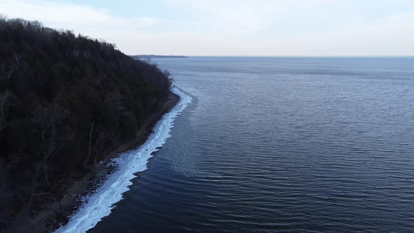 Aerial of Bay Shore Park off of Lake Michigan.  Door County Wisconsin.  Drone shot over Icy Shore Line.