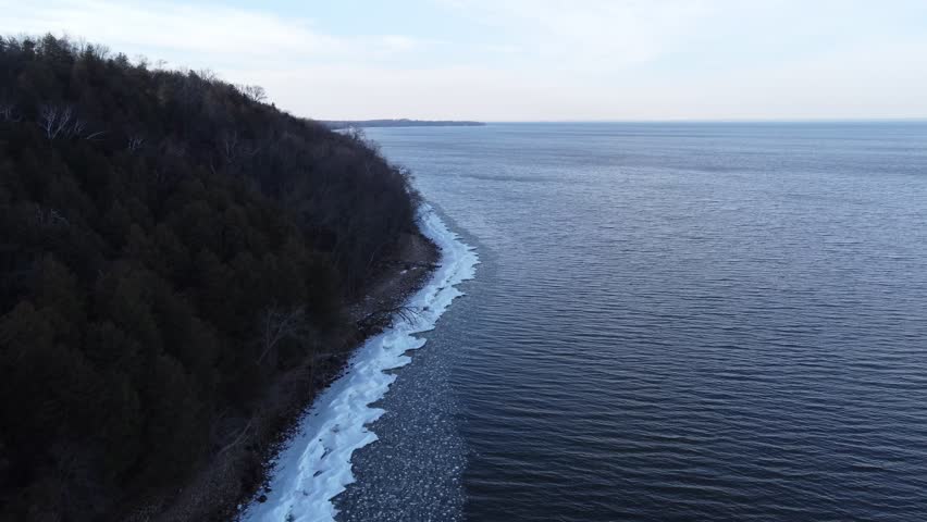 Aerial of Bay Shore Park off of Lake Michigan.  Door County Wisconsin.  Drone shot over Icy Shore Line.