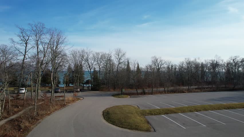 Aerial view of Lake Michigan coast line in Door County Wisconsin.  Drone over rugged shore with waves crashing.
