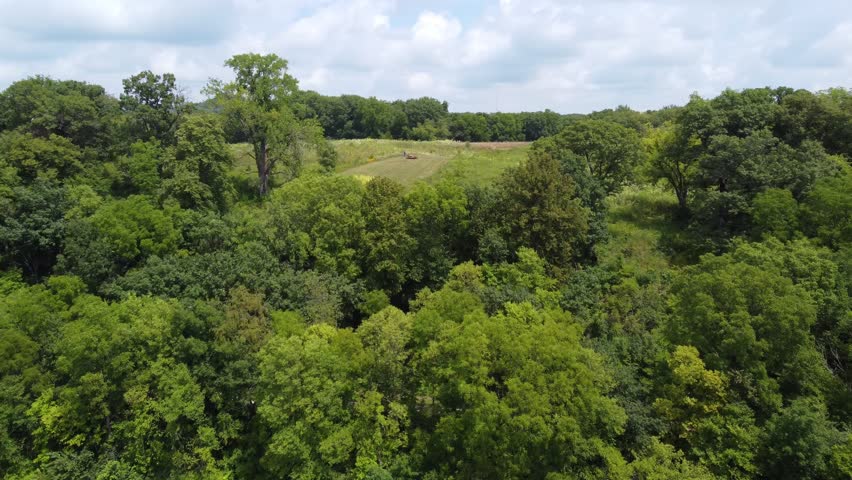 Aerial of Galena Illinois in the driftless area of the midwest.  Rising drone shot over hillside.