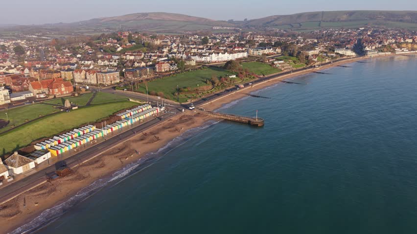 Aerial Drone Flyover of Swanage Bay and Jurassic Coastline in Dorset, UK, a dynamic aerial video of Swanage, a picturesque seaside town on the Jurassic Coast in Dorset, England.