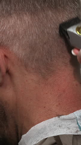 Caucasian Man Getting Careful Ear Contour Trim Closeup Protective Hold Gentle Clipper Strokes Salon Calm. Media