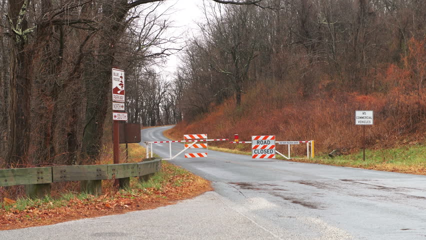 Blue Ridge Parkway highway scenic road closed sign with barricade barrier in Virginia in spring winter season scenery view