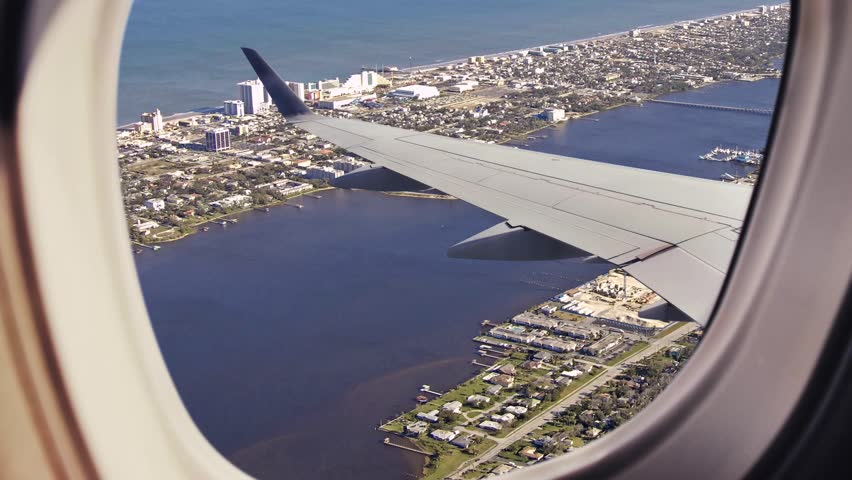 Panoramic aerial view of the city of Daytona Beach, Florida, United States of America. General view of the city of Daytona Beach, Florida seen from above through the window of an airplane