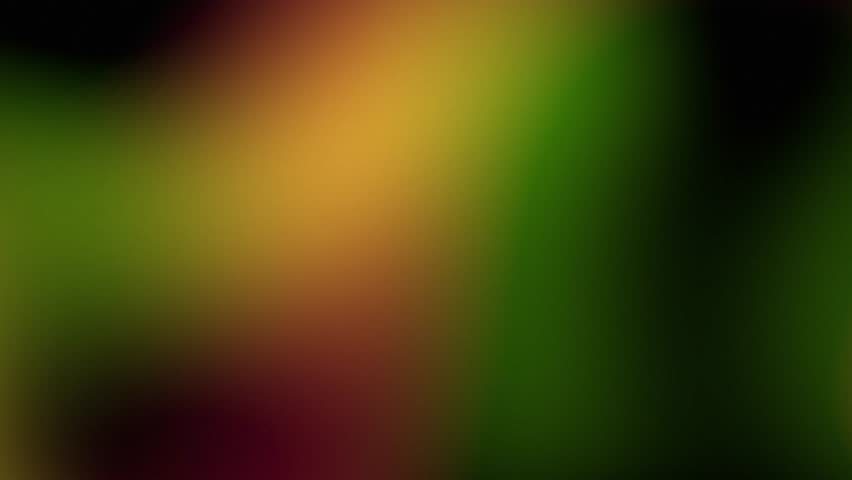 Abstract light leak transition with red, orange, and green color spectrum on black background, for visual effect