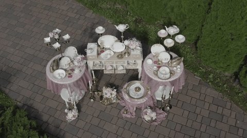 Drone Flying Down Closely toward Decorative Tea