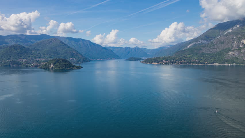 Time lapse, panoramic view on a lake where Lake Como’s three branches meet. Lake Como, Lombardy, Italy.