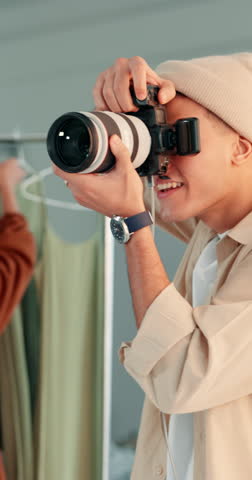 Creative, photographer and man with camera, studio and happy for photoshoot in backstage or session. Shooting, picture and artist with smile for photography, behind the scenes and person with tech