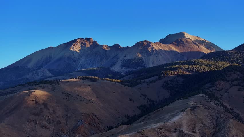 Sunlit Borah Peak towering above rugged range along Highway 93 in Idaho