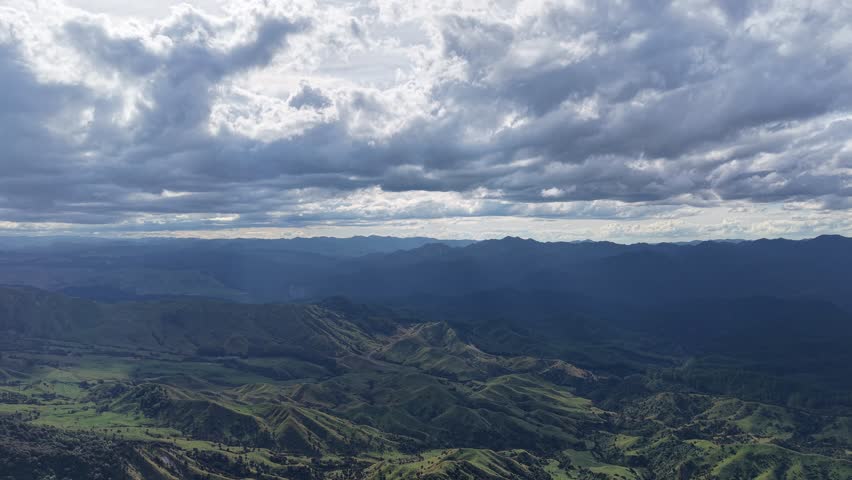 Epic Aerial View of New Zealand Mountains and Valley Under Dramatic Clouds